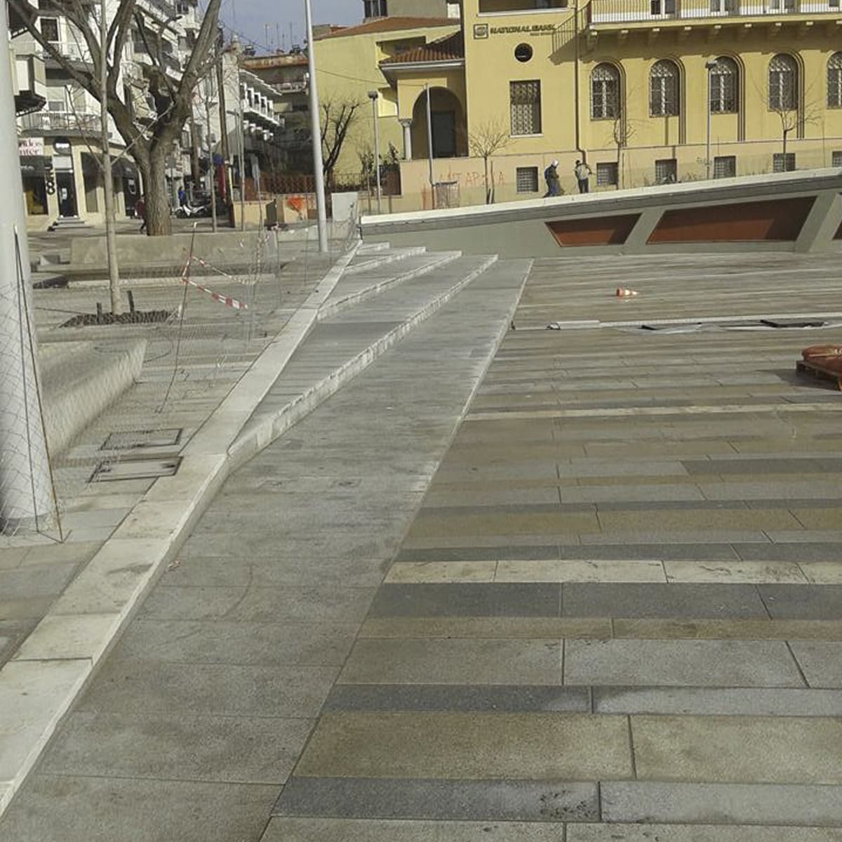 Accessible stone plaza with ramp and steps